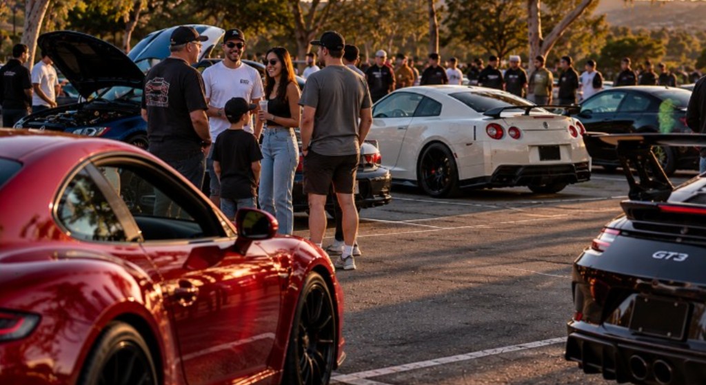 People gathered with their cars at a sunset meetup